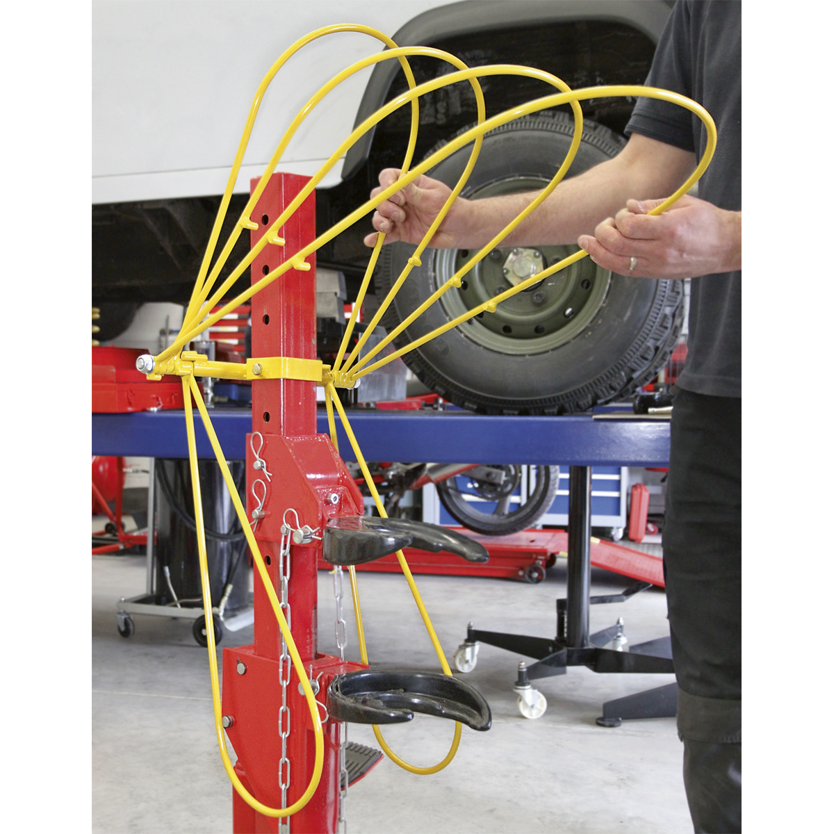 Restraint System for Coil Spring Compressors
